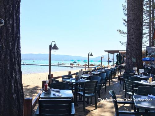 a row of tables and chairs on the beach at COH1669 - Hawk's View Hideaway home in South Lake Tahoe