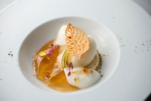 a plate of food with ice cream and sauce at Setre Marina Biwako in Moriyama