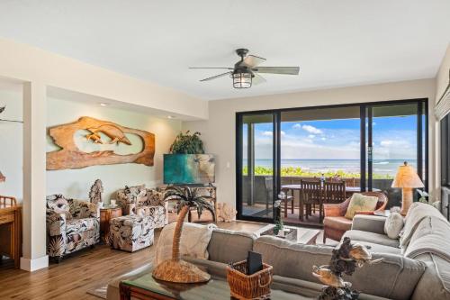 a living room with a couch and a table at Kahana Village 36 · KHV 36 Oceanfront 3BD Kahana Condo, Beach & in Lahaina