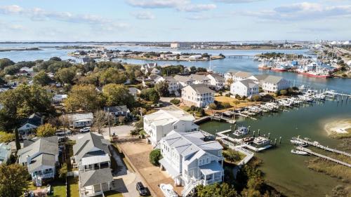 an aerial view of a harbor with houses and boats at Bridgeview on Broad home in Beaufort