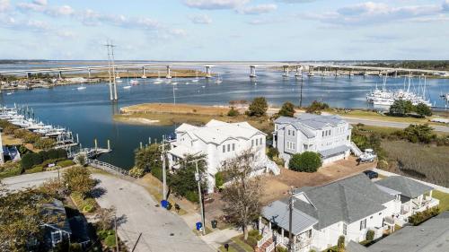 an aerial view of a house and a marina at Bridgeview on Broad home in Beaufort