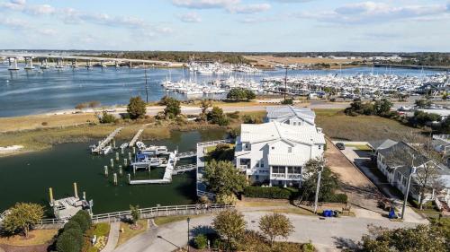 an aerial view of a marina with boats in the water at Bridgeview on Broad home in Beaufort