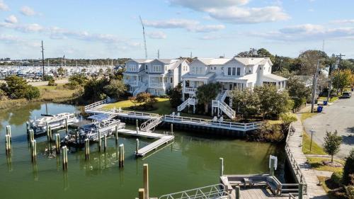 a group of houses on a river with a dock at Bridgeview on Broad home in Beaufort