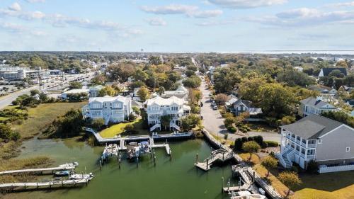 an aerial view of a town with houses and a harbor at Bridgeview on Broad home in Beaufort
