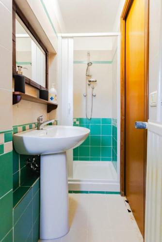 a bathroom with a sink and a shower at L'Orologio in Tivoli