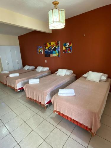 Postel nebo postele na pokoji v ubytování Residencial Dragão