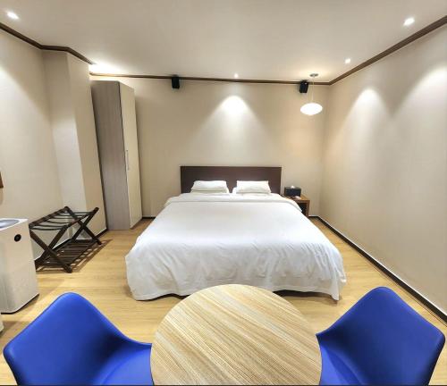 Ένα ή περισσότερα κρεβάτια σε δωμάτιο στο Lounge Seoul