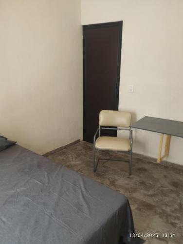 a room with a desk and a chair and a table at Depa in Mazatlán