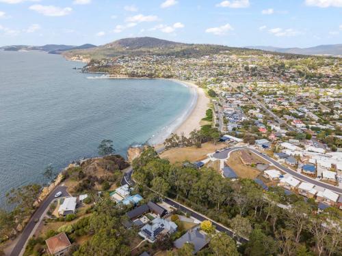 an aerial view of a city and a beach at Gorgeous 4 Bedroom House - Blackmans Bay in Kingston Beach