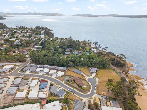 an aerial view of a town next to the water at Gorgeous 4 Bedroom House - Blackmans Bay in Kingston Beach