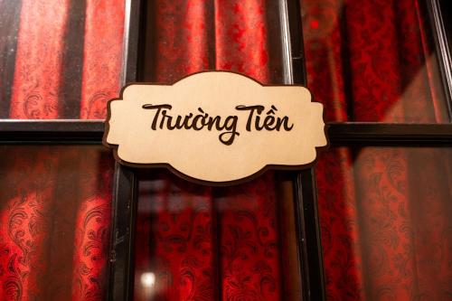 a sign that reads rushingken hanging on a curtain at Perfume Homestay Huế in Hue