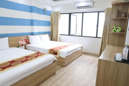 Hùng Vương Hotel Hạ Longにあるベッド