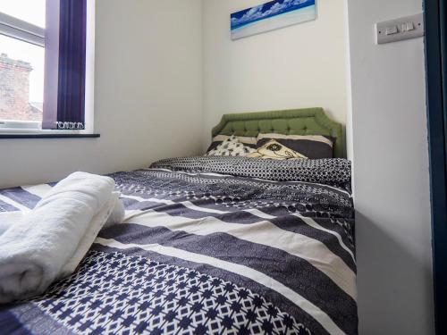 a bedroom with two beds and a window at Chatham Lodge Double Room 3 Ensuite in Stoke on Trent