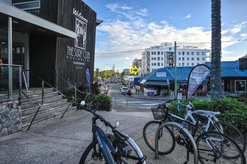 a group of bikes parked next to a building at Aegean Dream Mooloolaba Escape in Mooloolaba