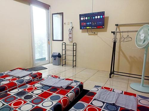 Postel nebo postele na pokoji v ubytování Bahagia Sederhana Homestay