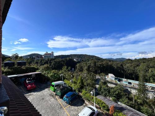 a view of cars parked in a parking lot at Tekoma Resort Cameron Highlands in Tanah Rata