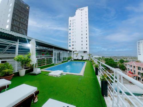 a balcony with a swimming pool on top of a building at Lanxy Hotel Nha Trang in Nha Trang