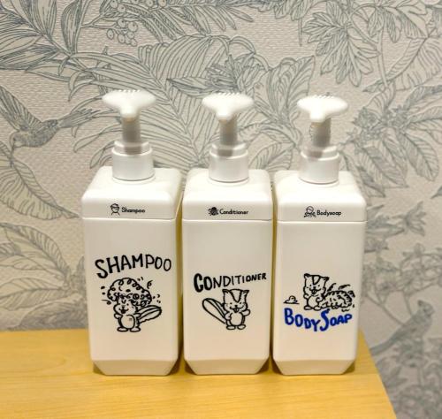 three bottles of soap sitting on top of a shelf at Japan Kominka in perfect location for Mount FUJI trip in Fujiyoshida