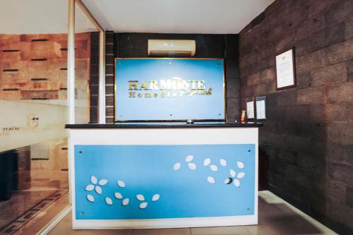 a blue counter with footprints on it in a museum at Hotel O Brawijaya Near Universitas Brawijaya Formerly Harmonie Residence in Malang