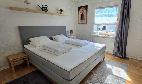 Postel nebo postele na pokoji v ubytování Hus Jonna