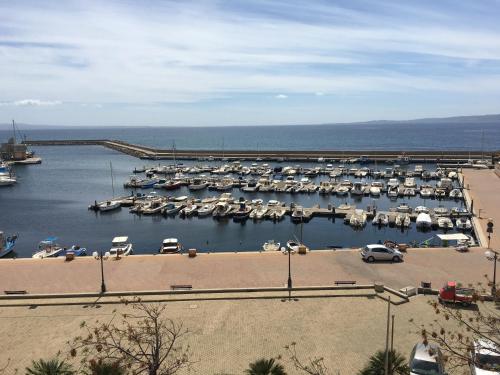 a bunch of boats parked in a marina at Hotel Don Pedro in Portoscuso