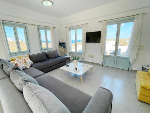 a living room with a couch and a table at SEA villa in Monolithos