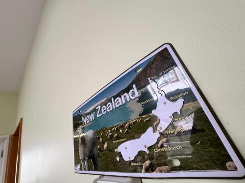 a sign on a wall with a picture of a map at Free Parking -Kids Games Room w PS5, Arcade- Central-7 Bathrooms- Cinema in Christchurch
