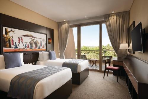 Postel nebo postele na pokoji v ubytování Ramada Resort By Wyndham Dar es Salaam