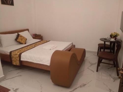 En eller flere senge i et værelse på KEN HOTEL