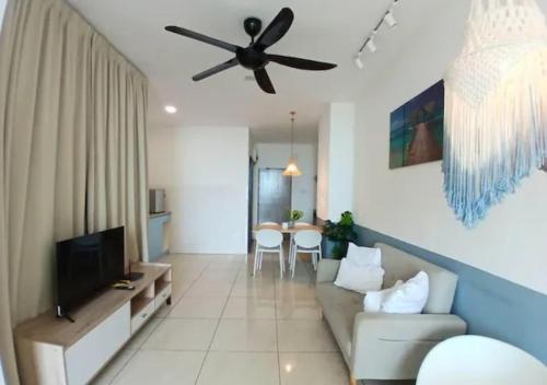 a living room with a couch and a ceiling fan at ITCC Manhattan by IGVC in Penampang