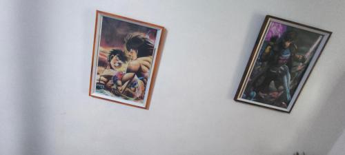 two pictures hanging on a white wall at DPMC Stay and Play Vacation Unit in Cainta