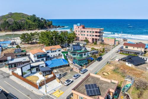 an aerial view of a city with the ocean at Samcheok Hideoksan Private Pool Villa in Samcheok