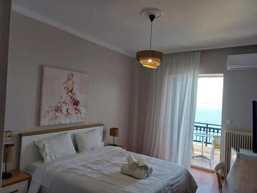 Postel nebo postele na pokoji v ubytování KAMVISSIS HOTEL