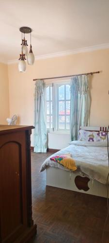 Letto o letti in una camera di Heritage View Homestay
