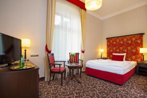 Łóżko lub łóżka w pokoju w obiekcie Cottonina Hotel & Mineral SPA Resort