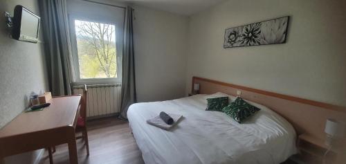 Postel nebo postele na pokoji v ubytování Hotel de la plage