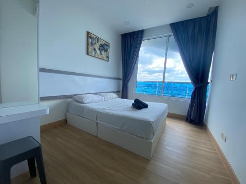 Postel nebo postele na pokoji v ubytování Melaka Town 5 mins to jonker Kota laksamana