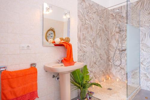 a bathroom with a sink and a shower at Ca Sa Tia -Sóller- in Sóller