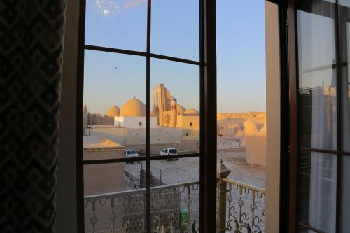 a view of a city from a window at Turon Khiva in Khiva