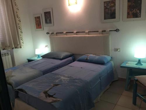 Una cama o camas en una habitación de Case Emma Mare