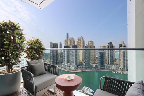 a balcony with a view of the city at 1BR Gem with Stunning Marina Views, Close to Metro in Dubai