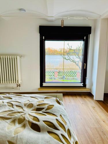 Katil atau katil-katil dalam bilik di Ferienwohnung im Haus am See