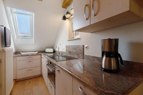 a kitchen with a coffee maker on a counter at Müllerleile Hof in Haslach im Kinzigtal