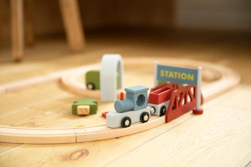 a toy train on a wooden toy track at VILLA Seamu 海風とどく広々贅沢GARDEN エアコン付きBBQルームを備えた高級ヴィラ in Kujukuri