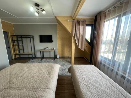 Ένα ή περισσότερα κρεβάτια σε δωμάτιο στο BIYIK House