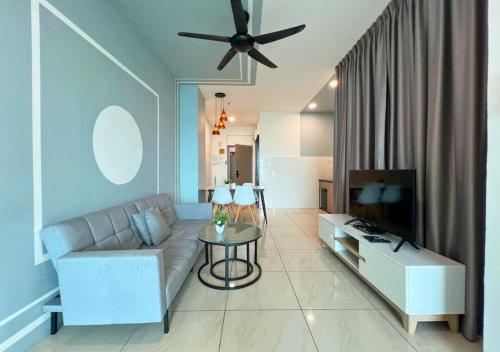 a living room with a couch and a ceiling fan at ITCC Manhattan by IGVC in Penampang