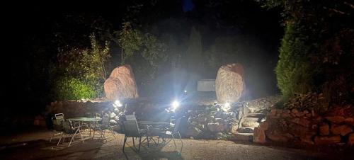 a truck parked in front of a stone wall at night at Ríocht Fódla in Killarney