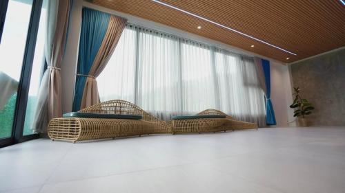Katil atau katil-katil dalam bilik di Highness Hotspring Resort
