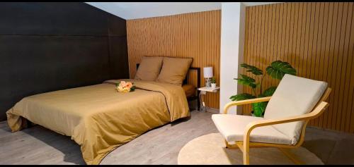 Ένα ή περισσότερα κρεβάτια σε δωμάτιο στο Paradis relaxant