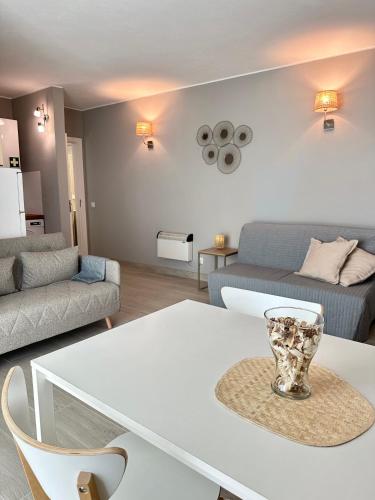 a living room with a white table and a couch at DonAna 308 in Lagos